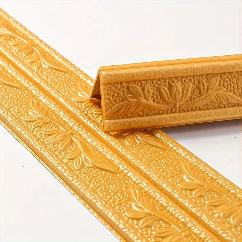 Gold self-adhesive foam wall trim strips with embossed floral patterns shown in close-up.