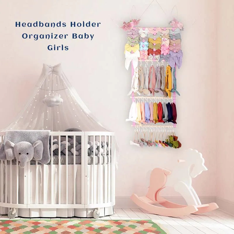 A wall-mounted headband organizer displaying colorful hair accessories for girls next to a white crib.