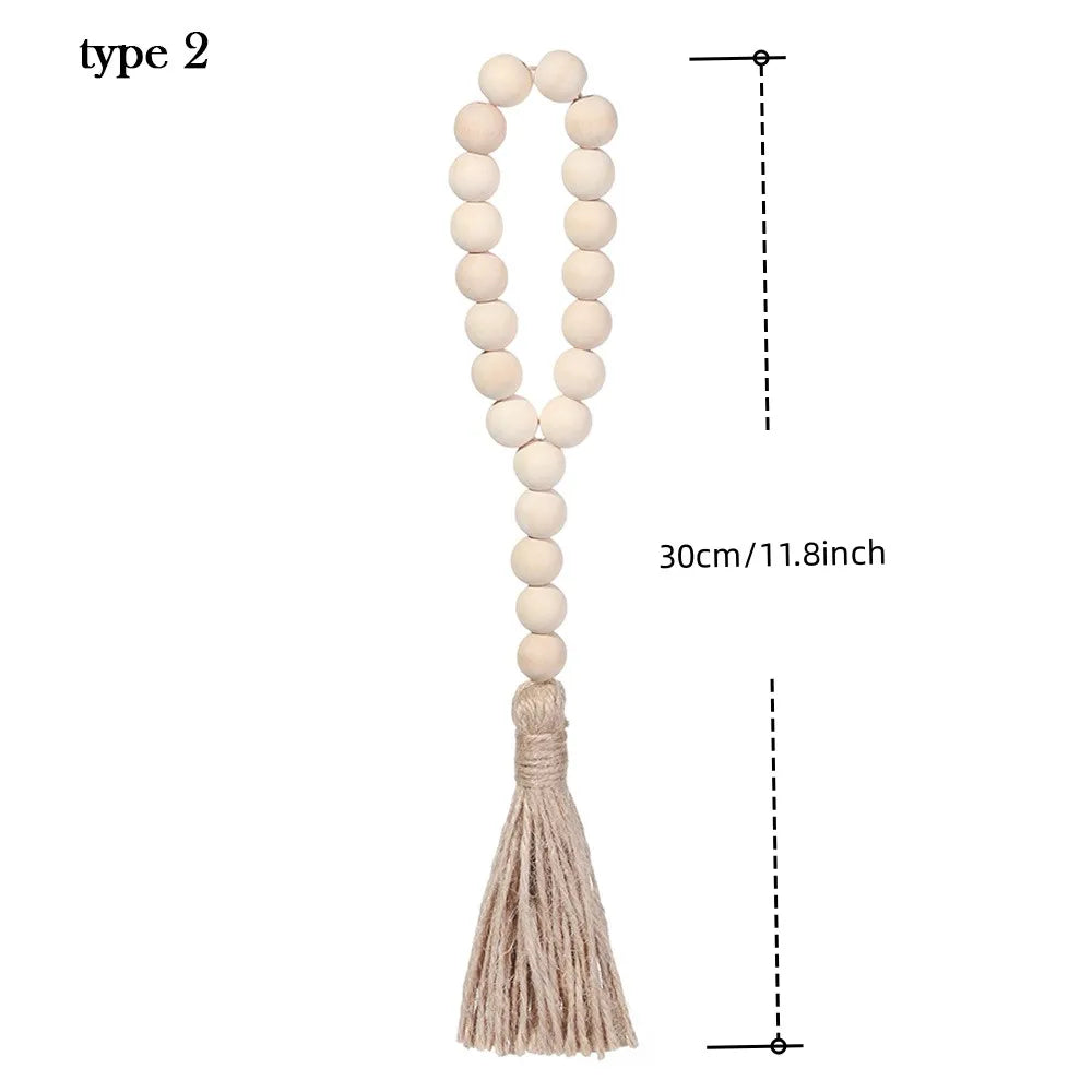 A beige wooden bead necklace with a long tassel, used as a type 2 wall hanging.