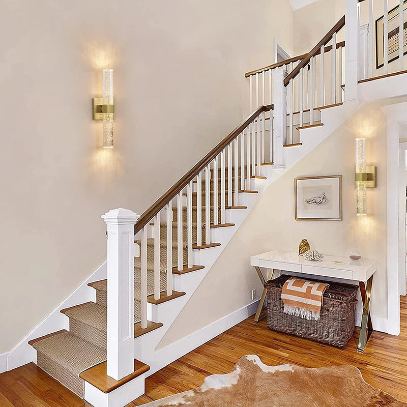 Modern bubble crystal LED wall sconces mounted on a staircase wall.