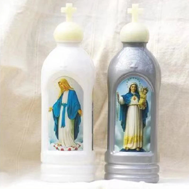 A pair of glow-in-the-dark holy water bottles featuring religious figures.