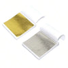 A set of edible gold leaf flakes for baking and cake decoration, shown in a white packaging box.