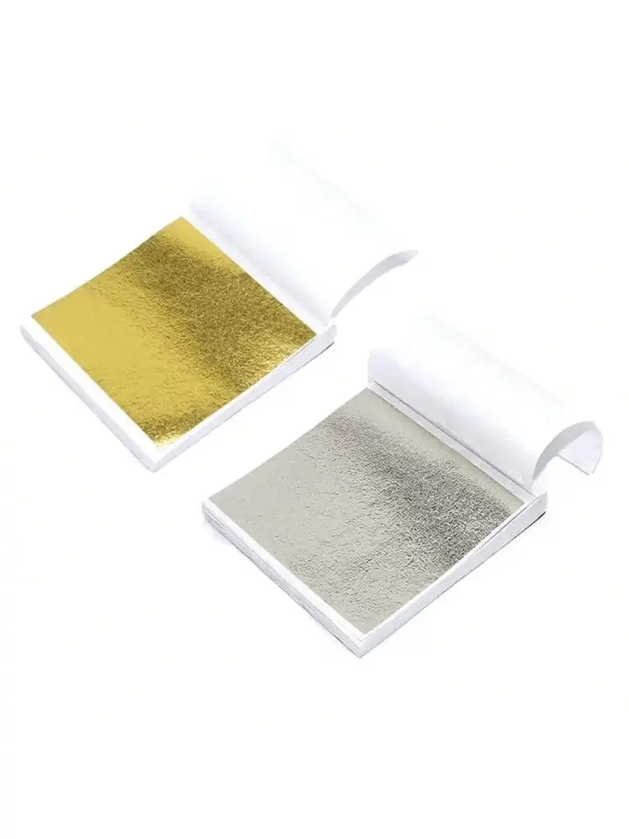 A set of edible gold leaf flakes for baking and cake decoration, shown in a white packaging box.