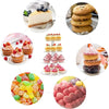 Elegant clear acrylic cupcake stand with three tiers displaying various cupcakes and pastries.