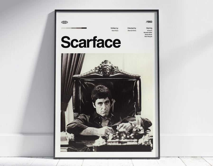 A framed black and white photograph of a man in a suit sitting at a table, titled Scarface.