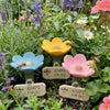 A set of bee watering station signs for garden decoration featuring cups for bees