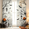 Halloween curtains featuring black tree branches, bats, lanterns, and pumpkins against a light background.
