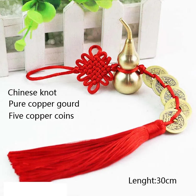 Antique copper five emperor coin pendant with a red Chinese knot and tassel