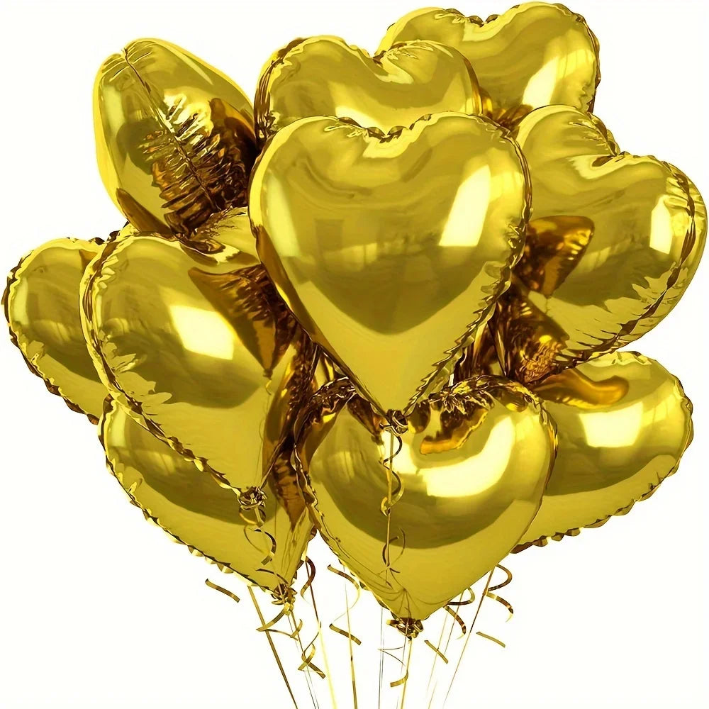 A bunch of gold heart-shaped foil balloons tied together with ribbons.
