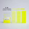 A set of bright lemon yellow candle dye colorants in various shades displayed next to a small container.