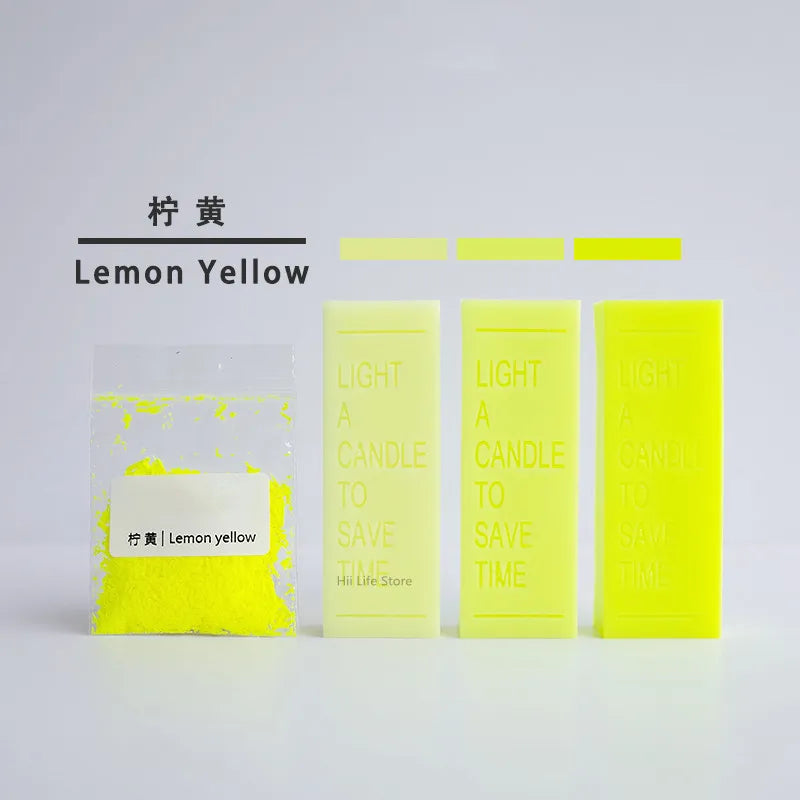 A set of bright lemon yellow candle dye colorants in various shades displayed next to a small container.