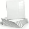 A square white marble peel-and-stick wall panel displayed on a stack of white panels.