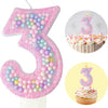 Pink glitter number 3 candle and cupcake set for a birthday celebration