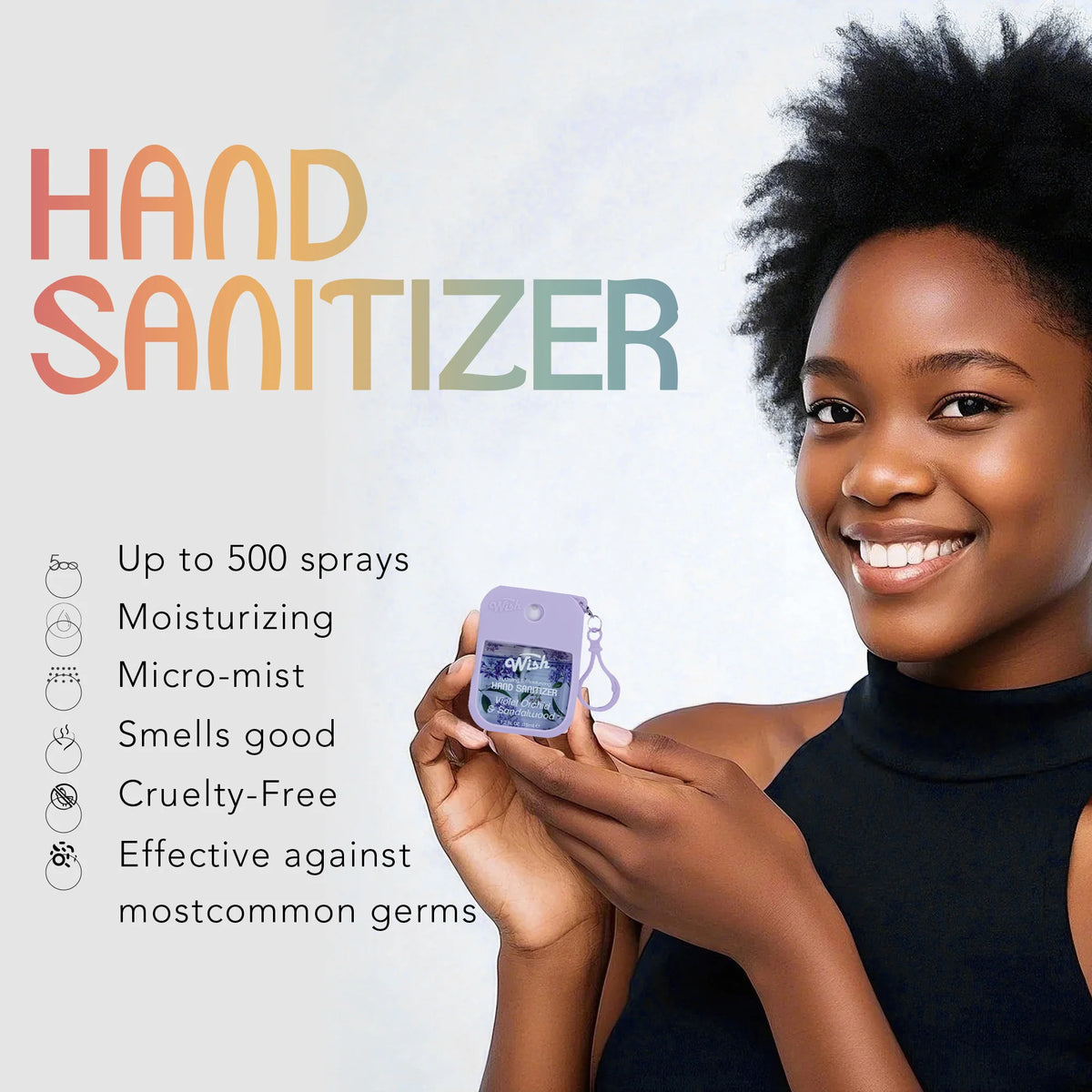 A smiling woman holds a purple hand sanitizer spray bottle against her skin.