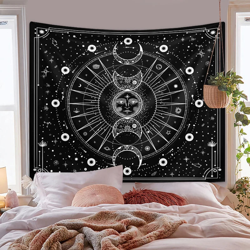 A black tapestry featuring a white psychedelic sun and moon mandala design hanging in a bedroom setting.
