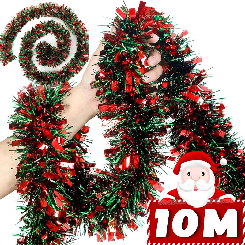 A hand is holding a festive Christmas tinsel garland made of red and green glittery strands.