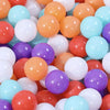 A collection of colorful, glossy, spherical plastic balls in shades of orange, pink, purple, and blue.