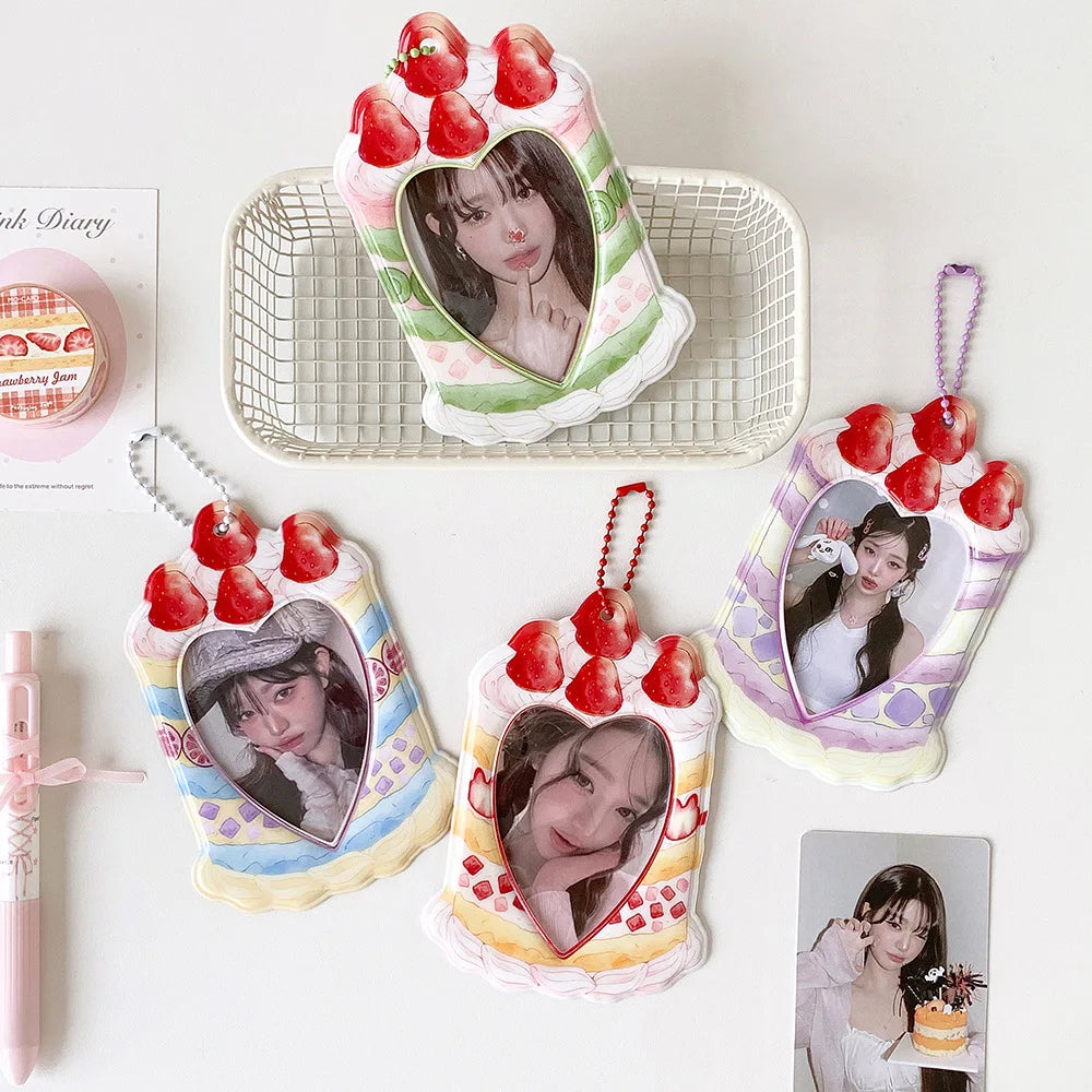 A set of pink and green cartoon strawberry bag keychains and card holders featuring a woman's portrait.