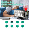 A multi-functional LED mirror projection clock displaying 23:00, shown next to a person sleeping.