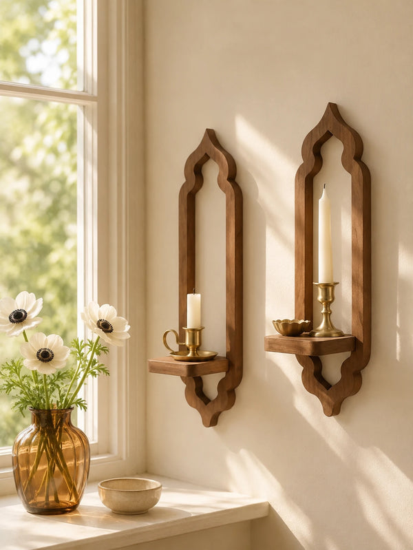 A rustic wooden arch wall shelf with a candle and small bowl displayed on a light-colored wall.