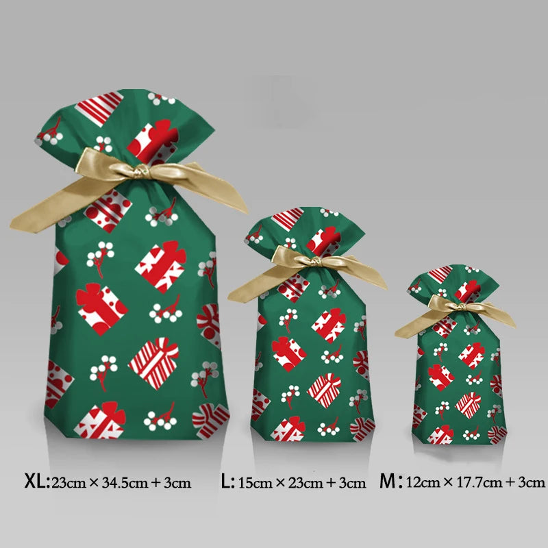 Festive Christmas drawstring gift bags in green fabric featuring red and white snowflake and Santa designs