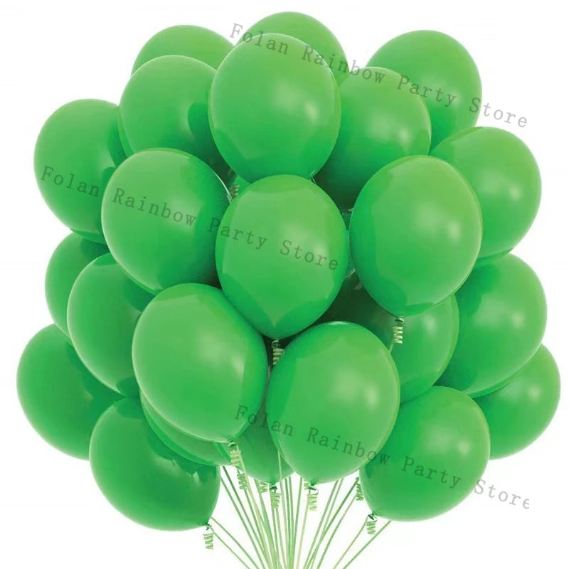 A bunch of matte latex balloons in various shades of green are shown, ready for a party decoration.