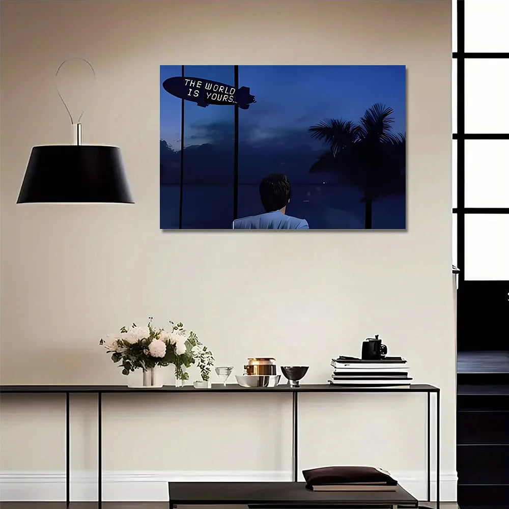 A framed canvas wall art poster featuring a dark blue background with the text The World Is Yours and a silhouette of a perso