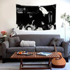 A large canvas wall tapestry featuring a dark, dramatic scene with figures and flags.