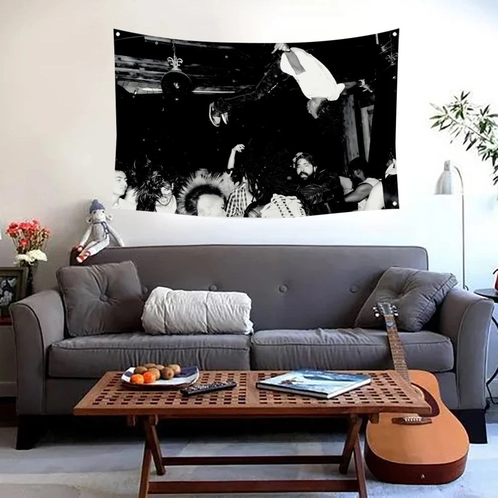 A large canvas wall tapestry featuring a dark, dramatic scene with figures and flags.