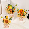 Handmade crochet sunflower bouquet with green leaves presented in a pink gift box