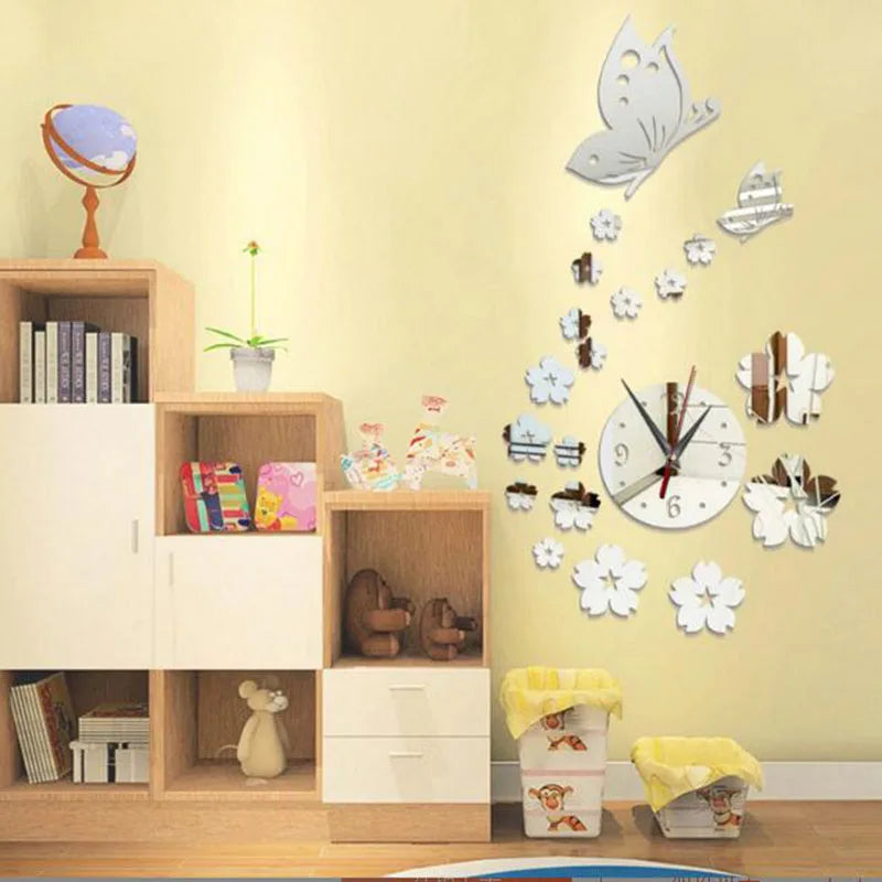 Modern acrylic mirror wall clock featuring a butterfly and floral design mounted on a light yellow wall.