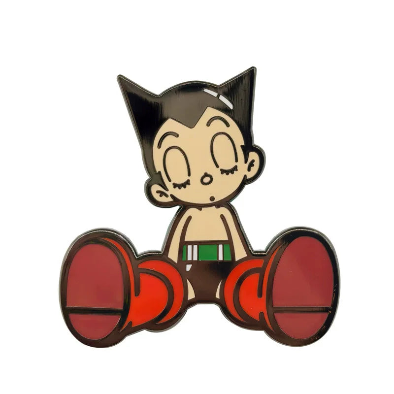 An enamel pin set featuring an animated character with black hair and large eyes, shown in a flat lay view.