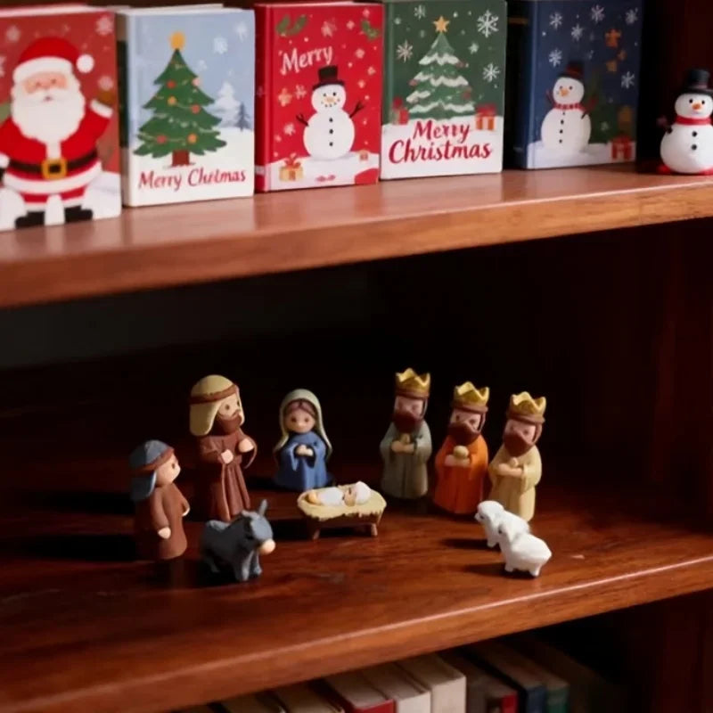 A collection of small, 3D printed nativity scene figures and ornaments displayed on a wooden shelf.