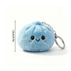 Light blue fluffy dumpling shaped squishy keychain with a silver ring and stitched eyes