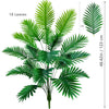 A vibrant green artificial palm tree featuring 18 silk leaves, displayed against a white background.