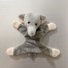 A soft gray elephant plush toy with light beige accents, designed as a fridge magnet.
