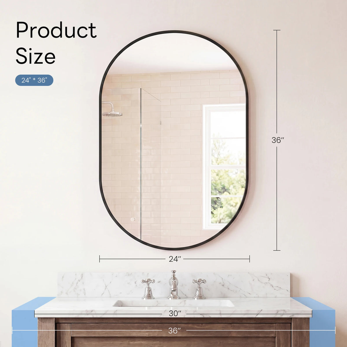 Oval wall mirror with a black metal frame hanging above a marble vanity top.