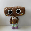 A brown plush toy resembling a face with large eyes and a white body, inspired by Dandy World.
