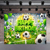 A vibrant soccer field backdrop decorated with green and yellow balloons, soccer balls, and festive lighting for a birthday p