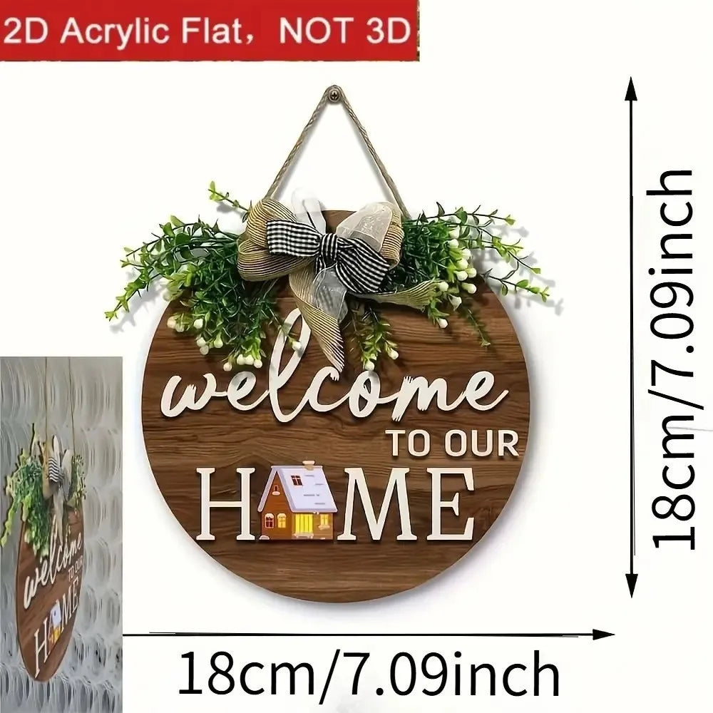 A round wooden welcome sign with the text welcome to our home surrounded by green foliage and a bow.