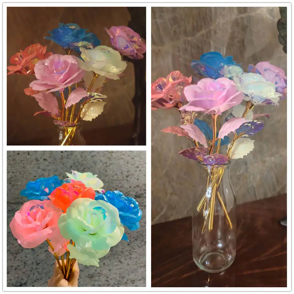A collection of glowing gold foil roses in various shades of pink, blue, and white arranged in a glass vase.