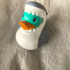 A white rubber duck bath toy with a gray back and an orange beak and green accents.
