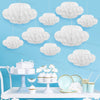A white 3D cloud honeycomb ball decoration set displayed on a white table with small pastries.