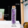 A tall glass bottle filled with purple amethyst crystals, measuring about 7cm and 0.86 inches.