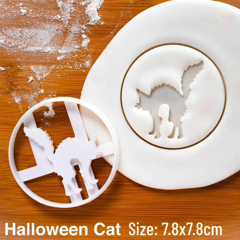 White silicone cookie cutters and fondant stamps shaped like cats on a wooden surface.