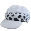 A white knit cap featuring a black polka dot pattern and a white brim.