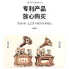 A pair of ornate, antique-style carousel music box decorations featuring small figurines and detailed metalwork.
