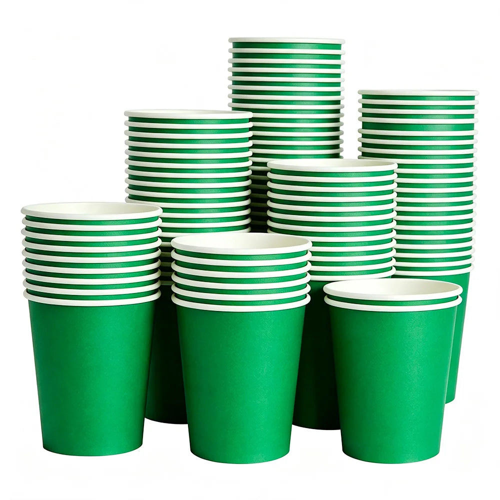 A stack of green disposable paper plates in various sizes and heights.