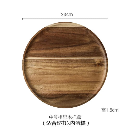 A round wooden cake tray with a glass dome cover, measuring 23cm in diameter and 1.5cm high.