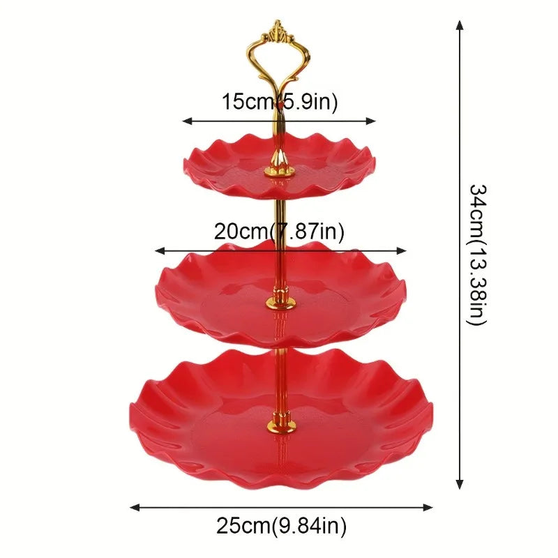 A red plastic three-tier dessert stand with gold accents.